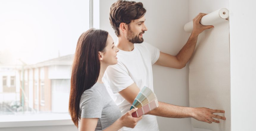 Young,Couple,Doing,Apartment,Repair,Together,Themselves